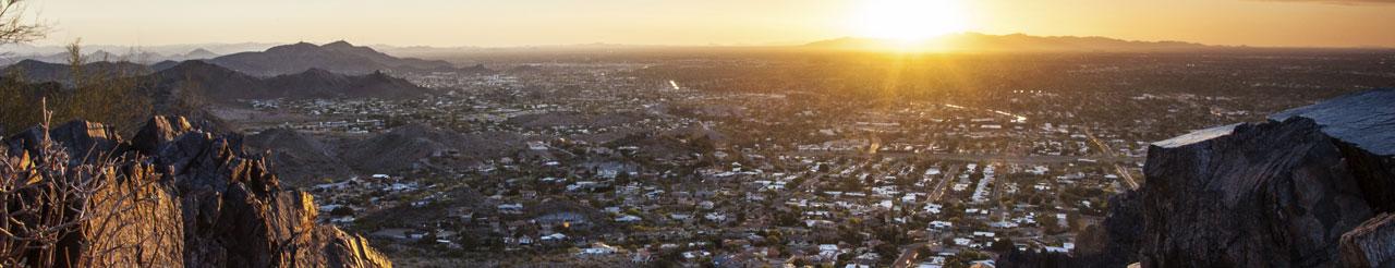 looking at city from on top of a mountain